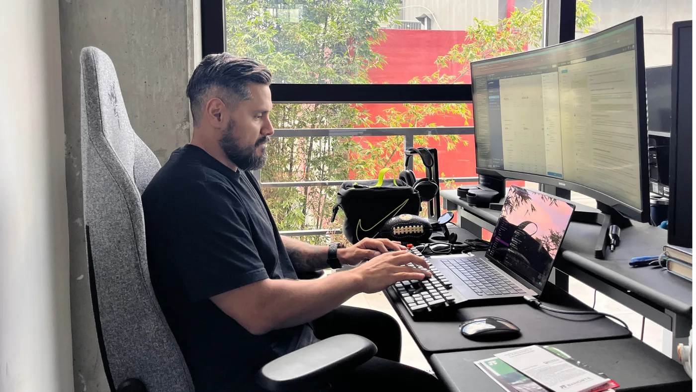 Developer working at a multi-screen setup